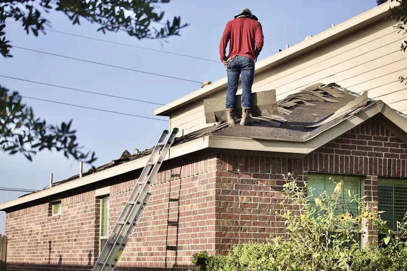 Professional roofer working on a residential roof in Pasadena Bear Creek Estates